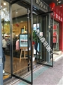门业图片-深圳定做各种玻璃门 地弹簧玻璃门黑钛金玻璃门店铺玻璃门客户要求图片